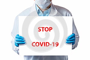 Doctor holding STOP COVID-19 sign isolated on white background. Coronavirus Covid-19 concept