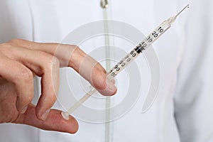 Doctor holding a syringe