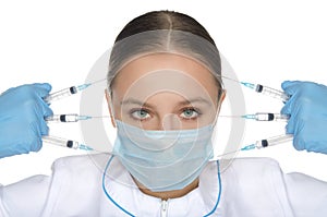 Doctor holding syringe front of face