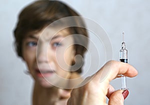 Doctor holding a syringe injection vaccination