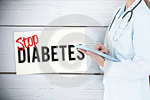 doctor holding tablet computer against prevention message background