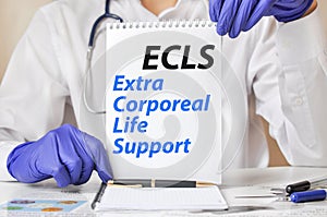 Doctor holding a tablet with text: ECLS. ECLS - Extra Corporeal Life Support, medical concept.