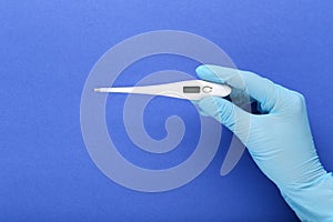 Doctor holding thermometer