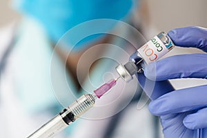 The doctor holding  a vaccine to prevent the Covid-19 virus. novel coronavirus 2019