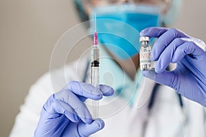 The doctor holding  a vaccine to prevent the Covid-19 virus. novel coronavirus 2019