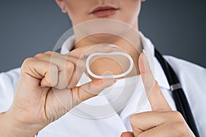 Doctor Holding Vaginal Ring photo