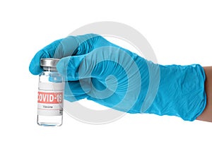 Doctor holding vial with vaccine against Covid-19 on white background, closeup