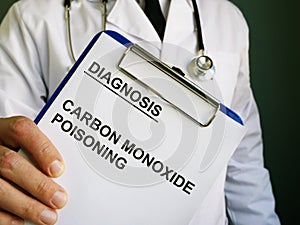 Doctor holds diagnosis Carbon monoxide poisoning