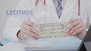 Doctor holds a generic Lecithin blister pack with softgels in his hand