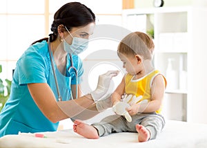 Doctor holds an injection vaccination the child photo