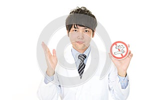 Doctor holds non smoking sign