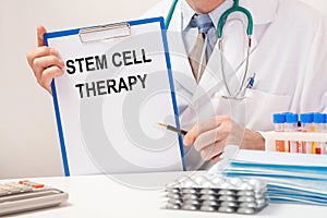 Doctor holds paper with inscription STEM CELL THERAPY