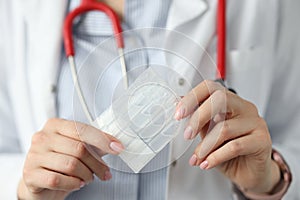 Doctor holds probiotics and prebiotics in his hand photo