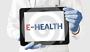 Doctor in holds a tablet with text E HEALTH