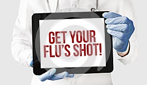 Doctor in holds a tablet with text get your flus shot