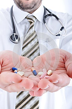 Doctor holiding pills