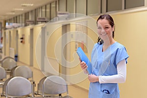 Doctor in hospital holding patient folder