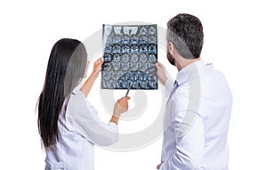 doctor in hospital looking at xray film healthcare, roentgen. medic in medical gown hold xray brain by radiographic photo