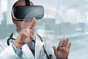 Doctor in a hospital pointing his finger on a virtual screen