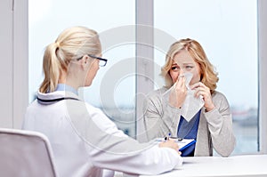 Doctor and ill woman patient with flu at clinic