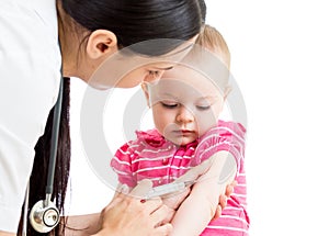 Doctor injecting baby isolated