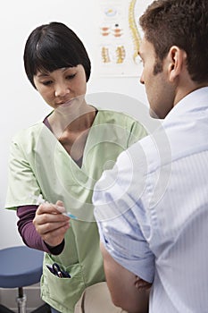 Doctor Injecting Patient photo