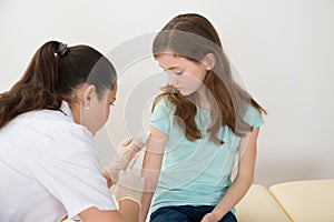 Doctor Injecting Syringe To Patient photo