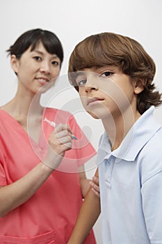 Doctor Injecting Vaccine To Patient photo