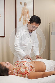 Doctor Inserting Acupuncture Needles