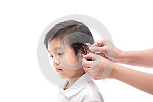 Doctor Inserting Hearing Aid