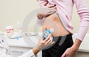 Doctor install patient insulin catheter for a simple injection of insulin.