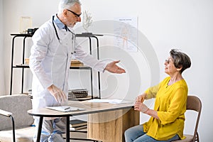 Doctor invites the patient to sit in the chair before starting the consultation