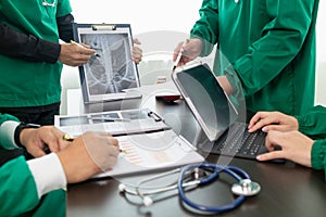 doctor joins a meeting with the surgeon's team to discuss a plan for cancer surgery after the medical team detects cancer.