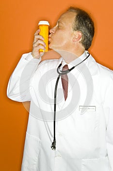 Doctor kissing medicine