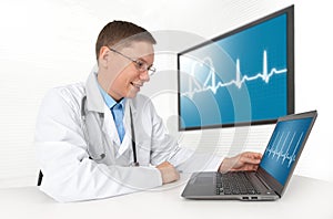 Doctor with laptop computer. Heart beat