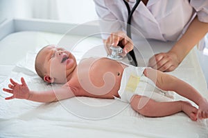 Doctor Listening To Baby`s Heart Beat