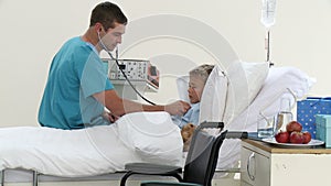 Doctor listening to a childs chest with stethoscope