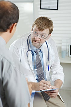 Doctor listening to patient