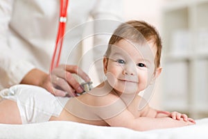 Doctor listens to baby heartbeat with stethoscope