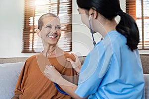 Doctor listens to heartbeat of older of retirement age to check their heart rate