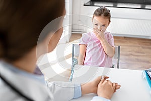 doctor and little girl patient coughing at clinic