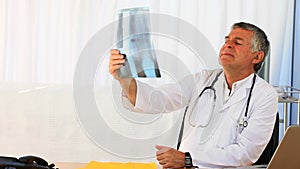 Doctor looking at his scan