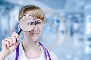 A doctor looking through a magnifier