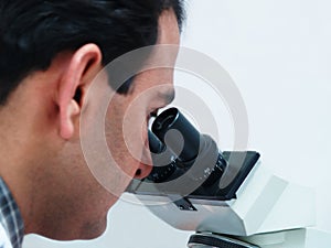 Doctor Looking In Microscope
