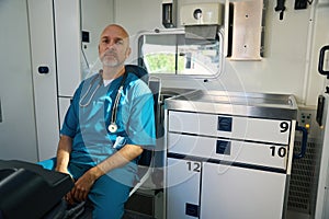 Doctor lounged on seat at the workplace in sterile conditions