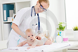 Doctor makes the baby massage