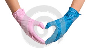 Doctor making heart with hands in different medical gloves