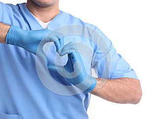 Doctor making heart with hands on white background, closeup