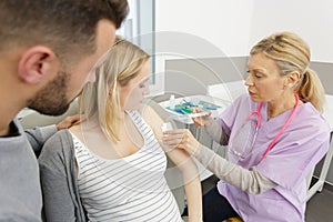 doctor making insulin or flu vaccination shot by syringe