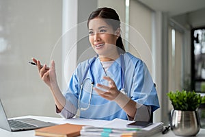 A doctor is making an online video call or having a medical consultation with a patient